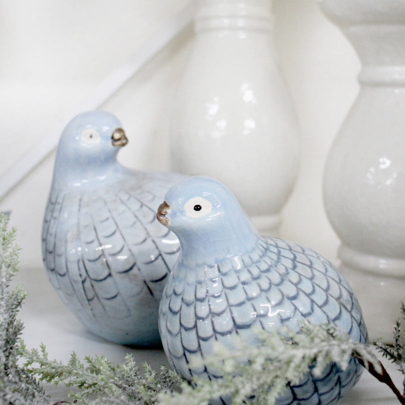 Two blue ceramic guinea fowl decorations in soft blue colour