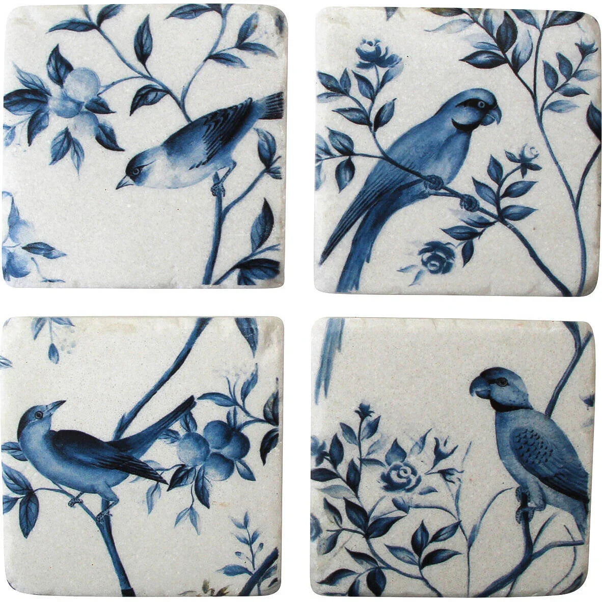 Set of four ceramic coasters with blue bird and floral design on a white background