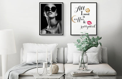 Framed black and white fashion wall art work of model wearing black sunglasses.