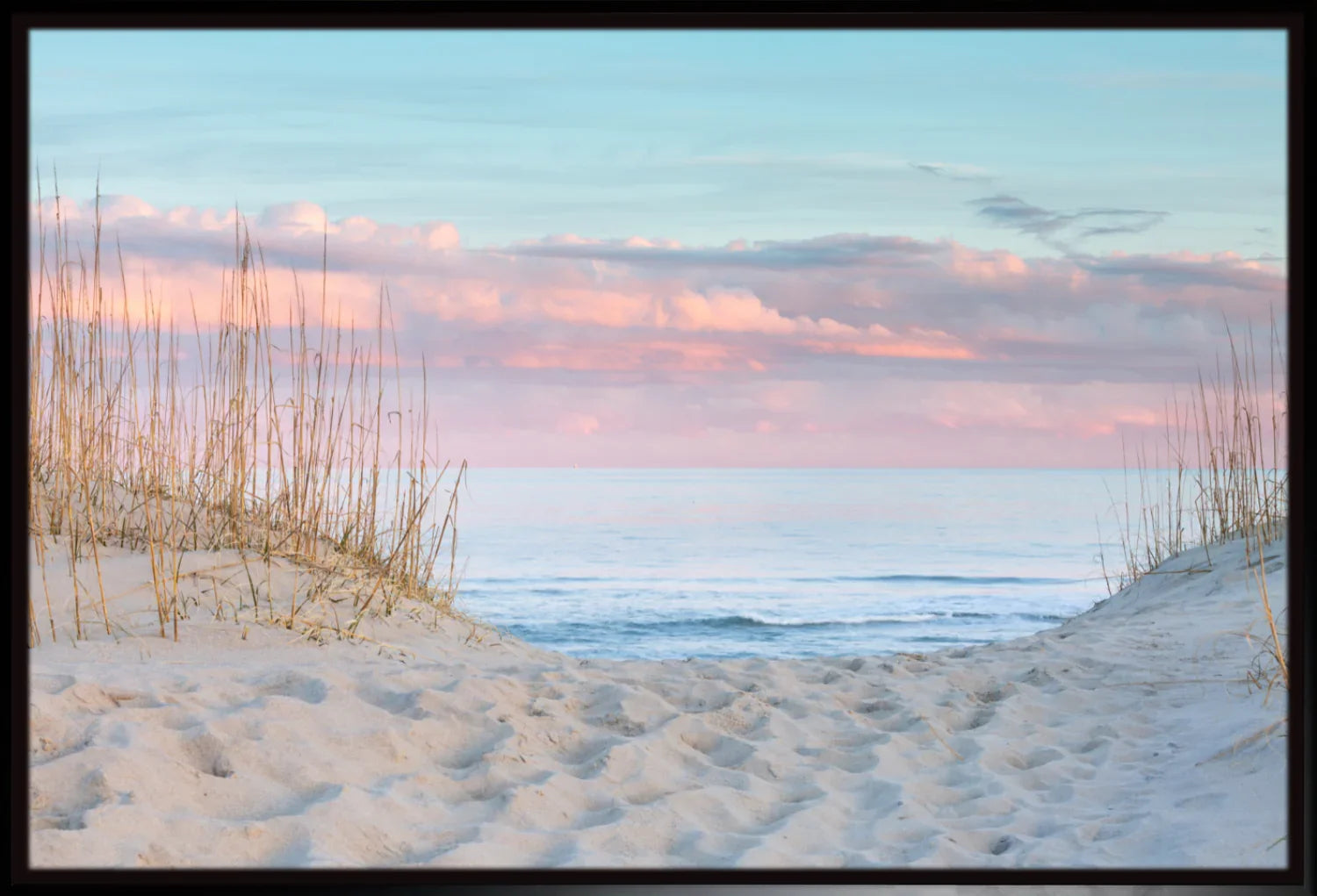 Beach scene with sand dunes and ocean at sunset wall art print