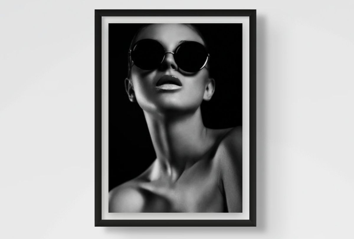 Framed black and white fashion art print of a woman wearing sunglasses.