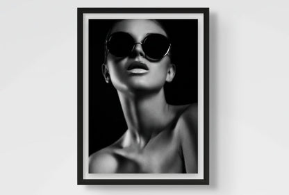 Framed black and white fashion art print of a woman wearing sunglasses.