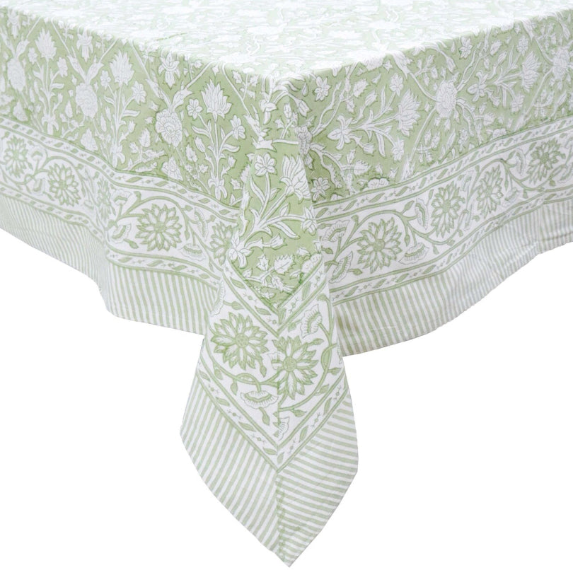 Green and white patterned tablecloth on a white background
