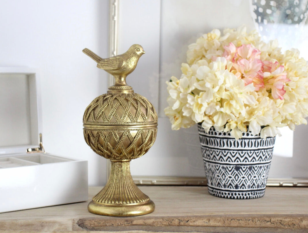 Decorative gold bird trinket box on pedaestal