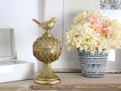 Decorative gold bird trinket box on pedaestal