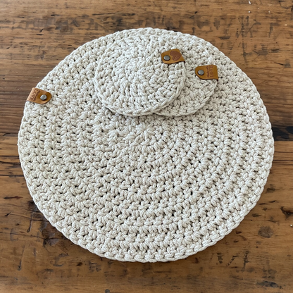 Round handmade crochet coasters and placemat beige