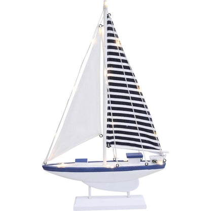 Model sailboat decoration with blue and white striped sail and LED lights