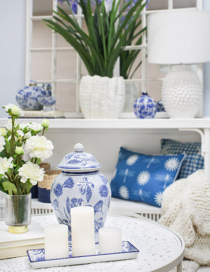 Blue and white porcelain rectangular plate styled with pillar candles in a Hamptons living room