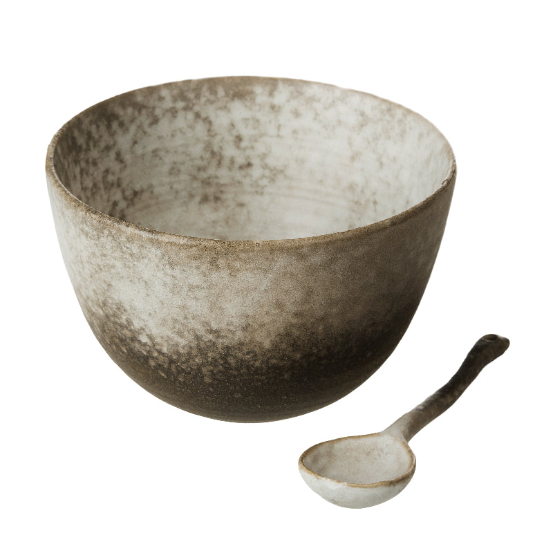 Cream and brown stoneware serving bowl and ceramic spoon set