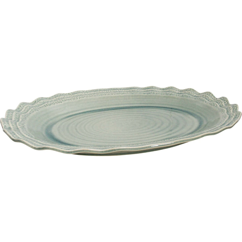 Extra large sage green ceramic oval serving platter with scalloped edge.