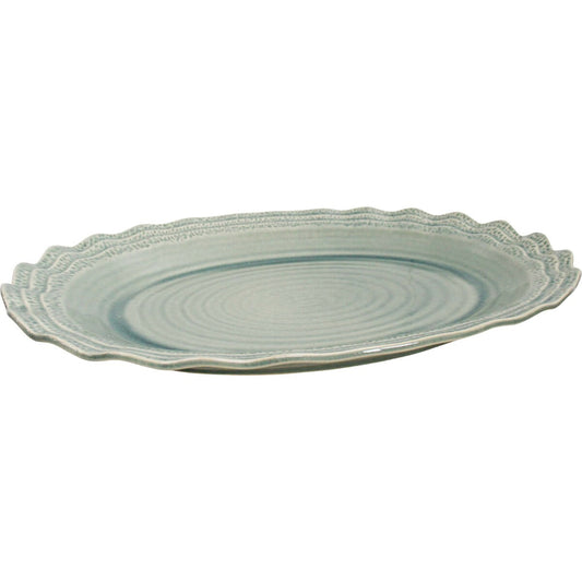 Extra large sage green ceramic oval serving platter with scalloped edge.