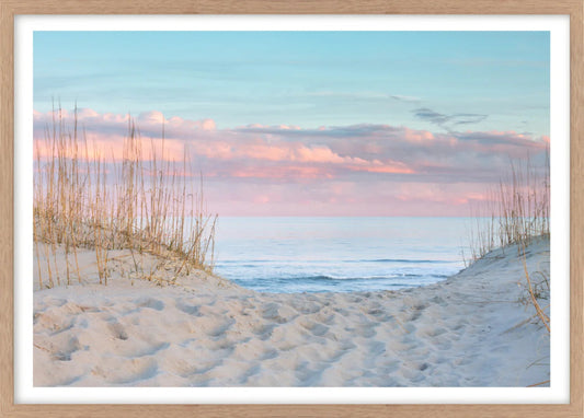 Beach scene wall art print with sand, dunes, and ocean at sunset.