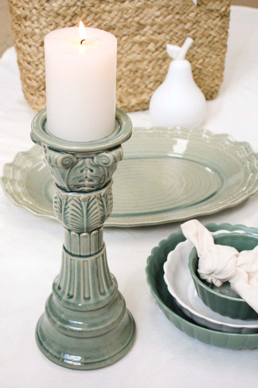 Sage green ceramic pillar candle holder styled with matching serving platter