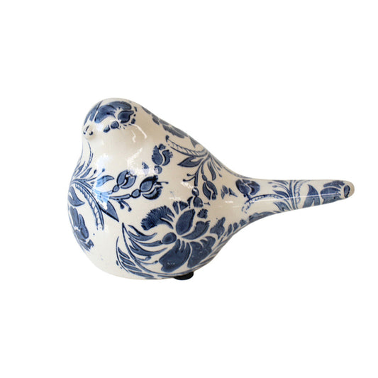 Ceramic bird figurine with blue floral patterns on a white background